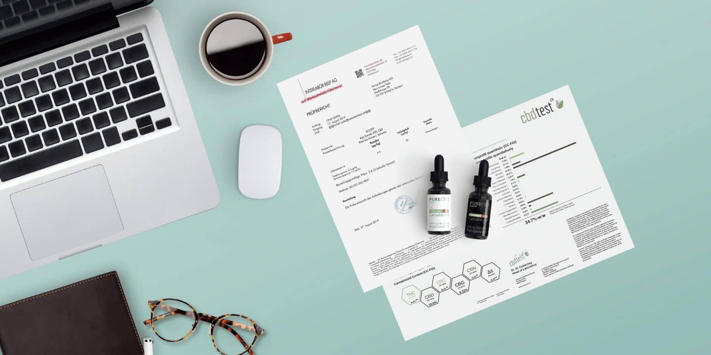 A desk showing lab reports for CBD oil